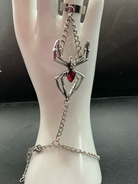 SILVER SPIDER HAND AND RING CHAIN BRACELET WITH RED RHINESTONE ACCENT